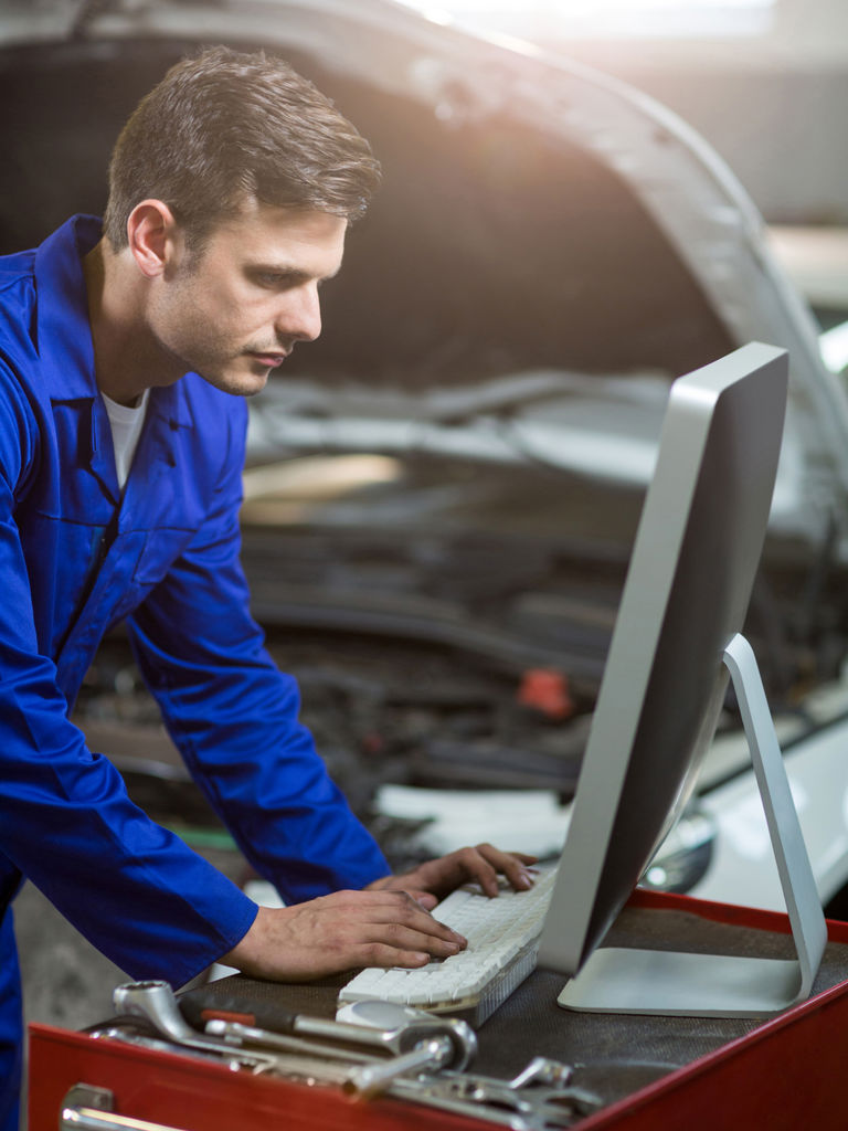 Mechanic Working Computer